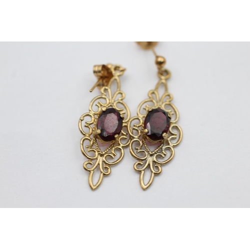 2164 - Three pairs of 9ct gold gemstone drop earrings, one garnet, one amethyst and one topaz - approx. gro... 