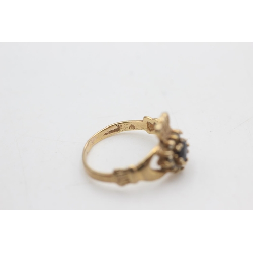 2166 - A 9ct gold sapphire and clear gemstone claddagh ring, size M½ - approx. gross weight 2.3 grams