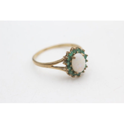 2167 - A hallmarked Birmingham 9ct gold emerald framed opal ring, size T - approx. gross weight 2.2 grams