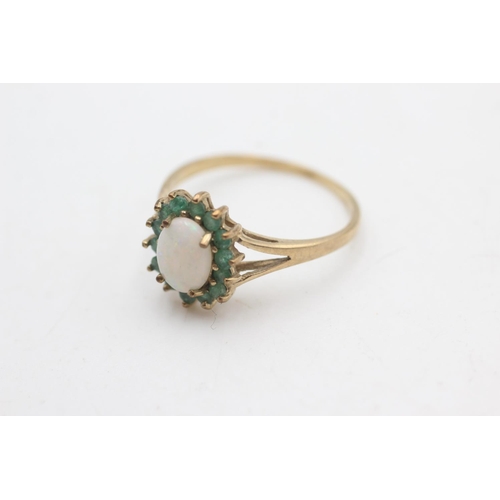 2167 - A hallmarked Birmingham 9ct gold emerald framed opal ring, size T - approx. gross weight 2.2 grams