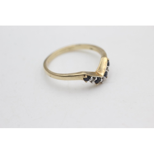 2169 - A 9ct gold sapphire and diamond wishbone ring, size O - approx. gross weight 1.8 grams