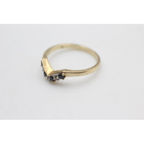 2169 - A 9ct gold sapphire and diamond wishbone ring, size O - approx. gross weight 1.8 grams