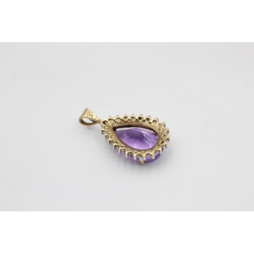 2171 - Two 9ct gold amethyst pendants. One diamond halo teardrop and one cross - approx. gross weight 4 gra... 