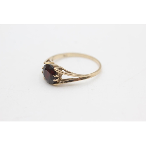 2174 - A hallmarked London 9ct gold garnet solitaire ring, size L - approx. gross weight 1.5 grams