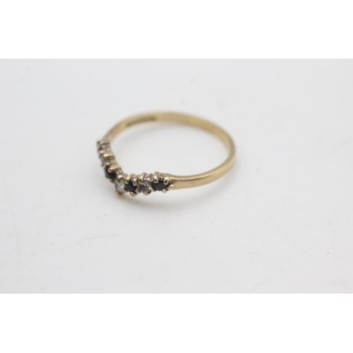 2178 - A hallmarked Birmingham 9ct gold sapphire and clear gemstone wishbone ring, size N½ - approx. gross ... 