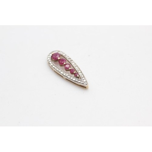 2180 - A 9ct gold diamond framed ruby pendant - approx. gross weight 1.4 grams