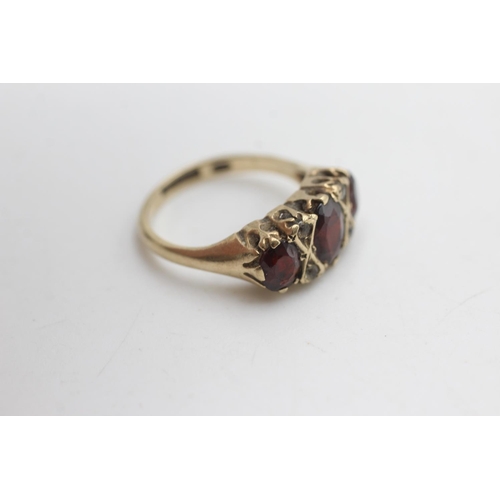 2184 - A 9ct gold garnet and paste gypsy set ring, size K½ - approx. gross weight 3.2 grams