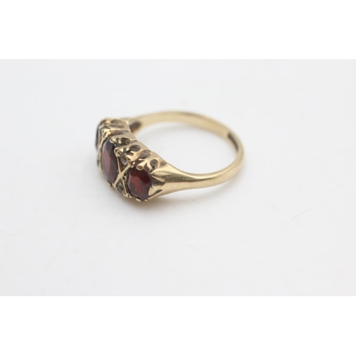 2184 - A 9ct gold garnet and paste gypsy set ring, size K½ - approx. gross weight 3.2 grams