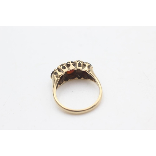 2184 - A 9ct gold garnet and paste gypsy set ring, size K½ - approx. gross weight 3.2 grams