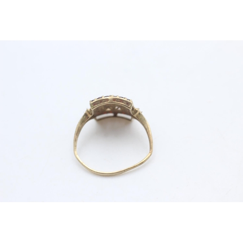 2194 - A 9ct gold garnet and diamond cutwork ring, size U½ - approx. gross weight 3 grams