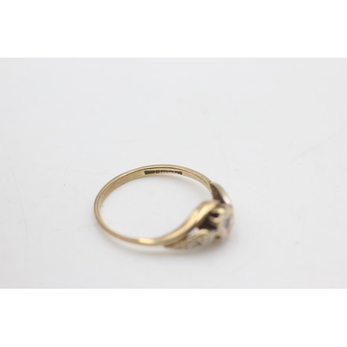 2197 - A hallmarked Birmingham 9ct gold diamond three stone stylised twist setting ring, size N - approx. g... 