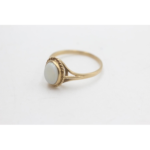 2200 - A hallmarked Birmingham 9ct gold rope framed opal solitaire ring, size P - approx. gross weight 1.6 ... 