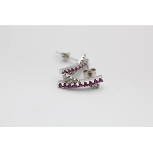 2210 - A 9ct white gold pink sapphire and diamond pendant necklace and stud earrings set - approx. gross we... 