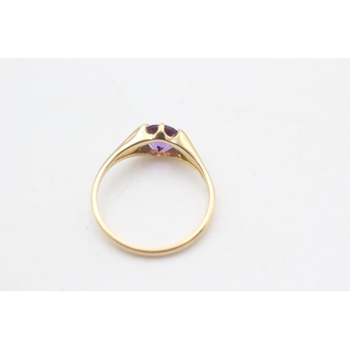 2213 - An 18ct gold amethyst solitaire ring, size N½ - approx. gross weight 2.1 grams