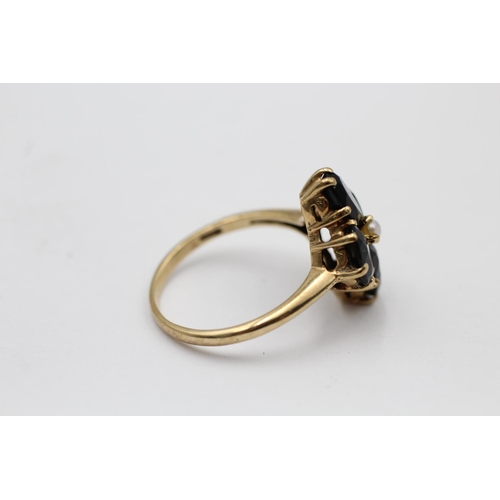 2218 - A 9ct gold tourmaline and seed pearl floral set ring, size P - approx. gross weight 3.6 grams