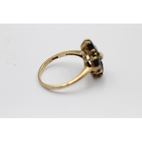 2218 - A 9ct gold tourmaline and seed pearl floral set ring, size P - approx. gross weight 3.6 grams