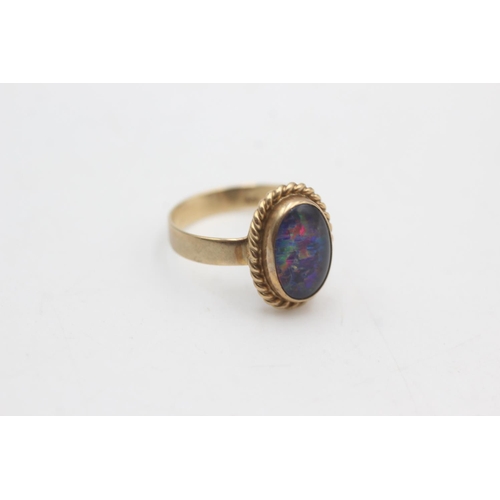 2220 - A 9ct gold rope framed opal solitaire ring, size N½ - approx. gross weight 2.5 grams