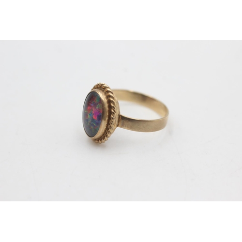 2220 - A 9ct gold rope framed opal solitaire ring, size N½ - approx. gross weight 2.5 grams