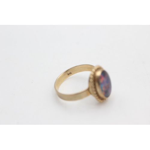 2220 - A 9ct gold rope framed opal solitaire ring, size N½ - approx. gross weight 2.5 grams