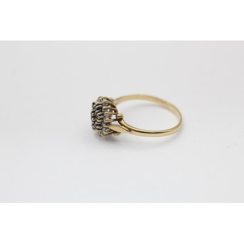 2228 - A hallmarked Birmingham 9ct gold diamond framed sapphire floral set ring, size N½ - approx. gross we... 