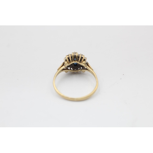 2228 - A hallmarked Birmingham 9ct gold diamond framed sapphire floral set ring, size N½ - approx. gross we... 