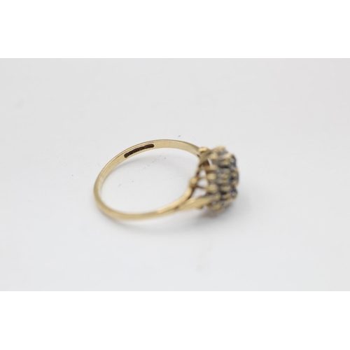 2228 - A hallmarked Birmingham 9ct gold diamond framed sapphire floral set ring, size N½ - approx. gross we... 