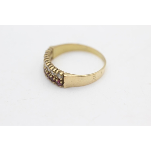 2230 - A 14ct gold ruby and clear gemstone ring, size Q½ - approx. gross weight 2.5 grams