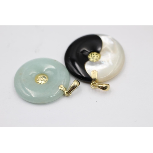 2236 - Two 14ct gold and gemstone oriental pendants, one onyx and mother of pearl and one jade - approx. gr... 