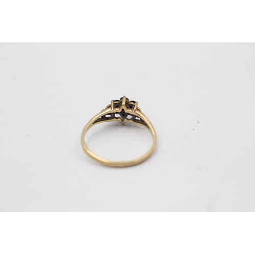 2244 - A 9ct gold sapphire framed diamond floral set ring, size L½ - approx. gross weight 1.3 grams