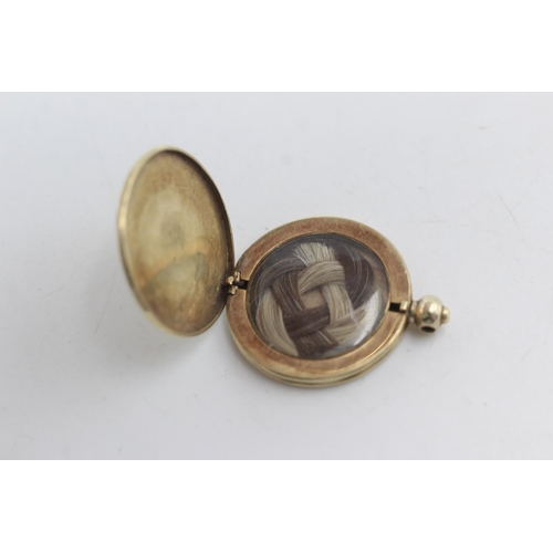 2248 - An antique 14ct gold back and front hairwork locket - approx. gross weight 6.8 grams