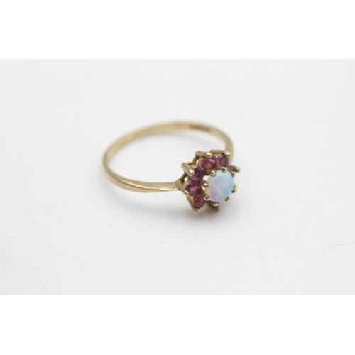 2253 - A hallmarked London 9ct gold ruby framed opal halo ring, size P - approx. gross weight 1.5 grams