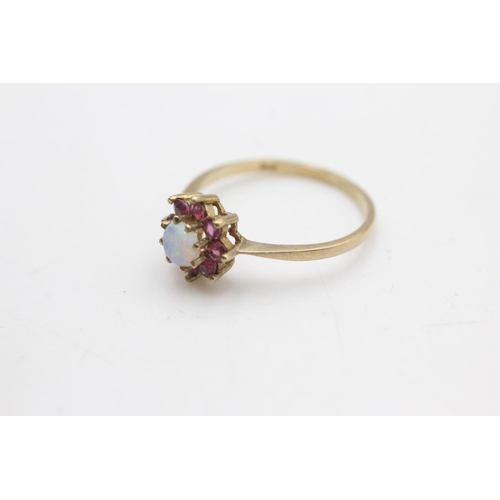 2253 - A hallmarked London 9ct gold ruby framed opal halo ring, size P - approx. gross weight 1.5 grams