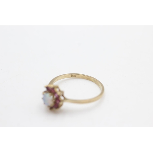 2253 - A hallmarked London 9ct gold ruby framed opal halo ring, size P - approx. gross weight 1.5 grams