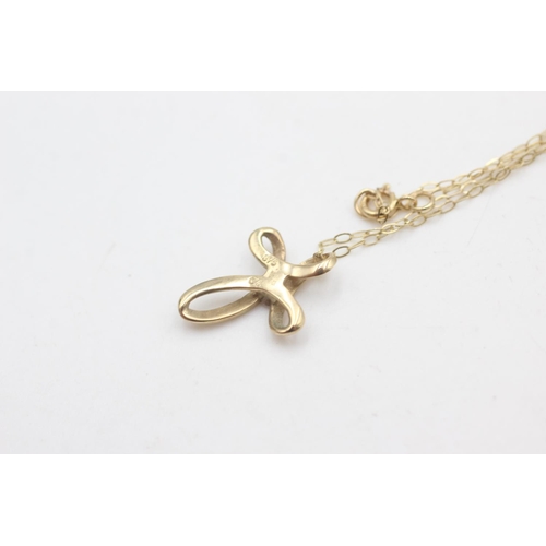 2258 - A 9ct gold clear gemstone set stylised cross pendant necklace - approx. gross weight 1 gram