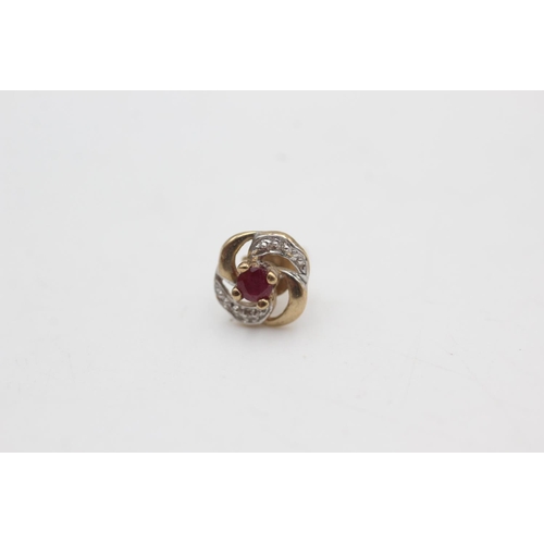 2266 - A pair of 9ct gold ruby and diamond swirl stud earrings - approx. gross weight 1.2 grams