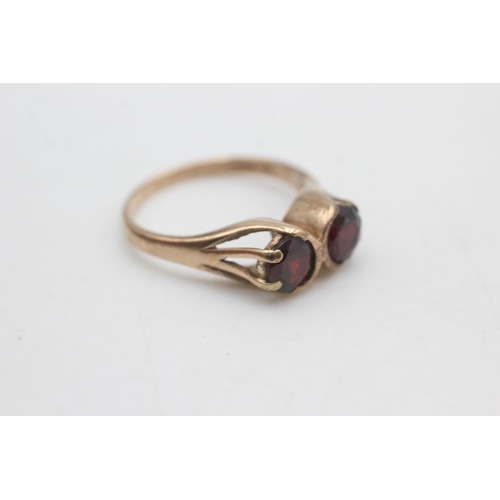 2275 - A hallmarked Birmingham 9ct gold two stone garnet ring, size Q½ - approx. gross weight 3.7 grams