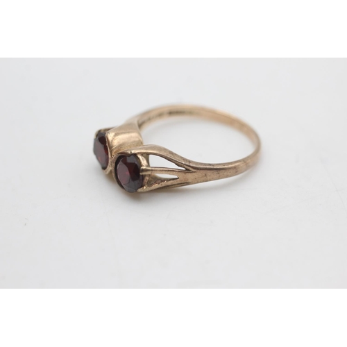 2275 - A hallmarked Birmingham 9ct gold two stone garnet ring, size Q½ - approx. gross weight 3.7 grams