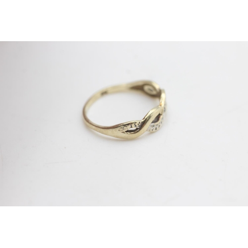 2279 - A 9ct gold diamond set infinity wave design ring, size K - approx. gross weight 1.1 grams