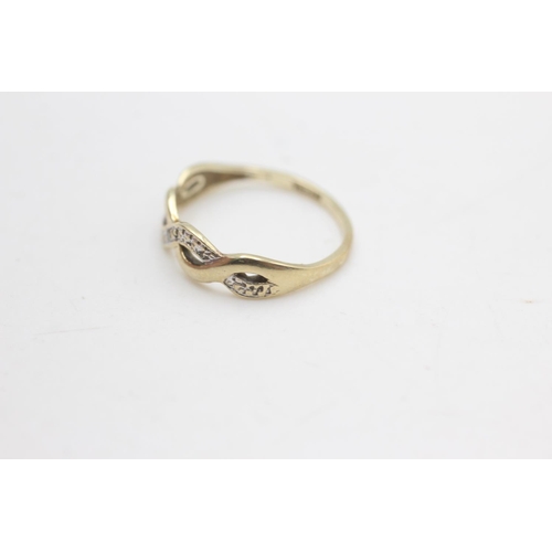 2279 - A 9ct gold diamond set infinity wave design ring, size K - approx. gross weight 1.1 grams