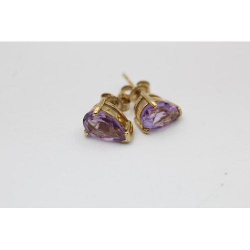 2288 - Two pairs of 9ct gold gemstone earrings, one opal drop and one amethyst stud - approx. gross weight ... 