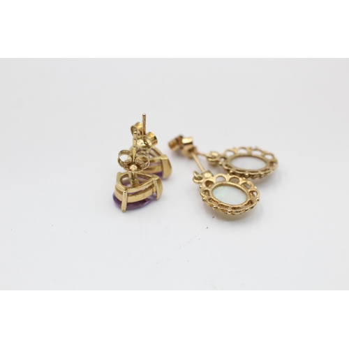 2288 - Two pairs of 9ct gold gemstone earrings, one opal drop and one amethyst stud - approx. gross weight ... 