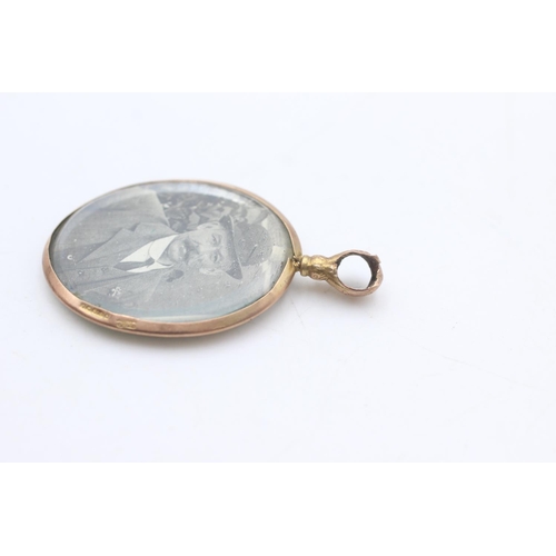 2291 - An antique 9ct gold framed double sided photo locket - approx. gross weight 6.2 grams