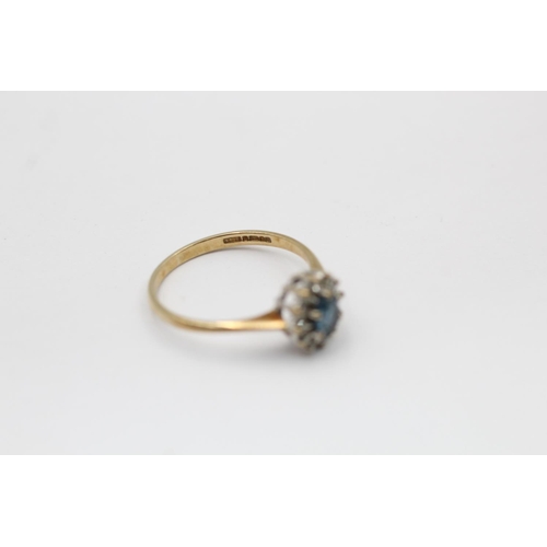 2292 - A hallmarked London 9ct gold topaz and diamond halo set ring, size N½ - approx. gross weight 1.7 gra... 