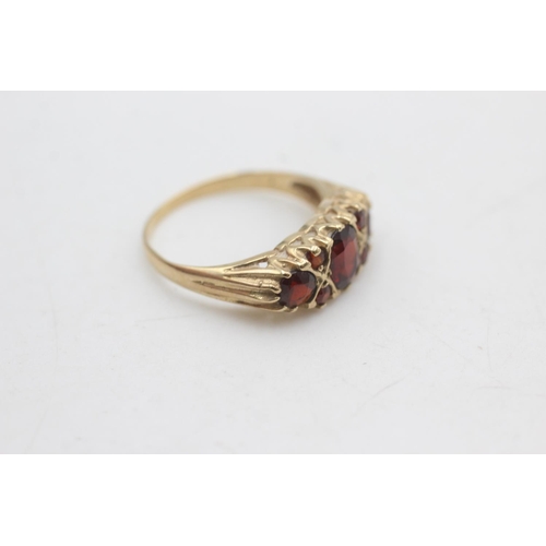 2293 - A 9ct gold garnet gypsy set ring, size P½ - approx. gross weight 2.6 grams