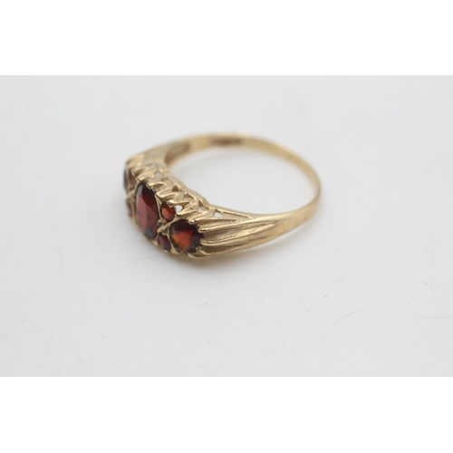 2293 - A 9ct gold garnet gypsy set ring, size P½ - approx. gross weight 2.6 grams