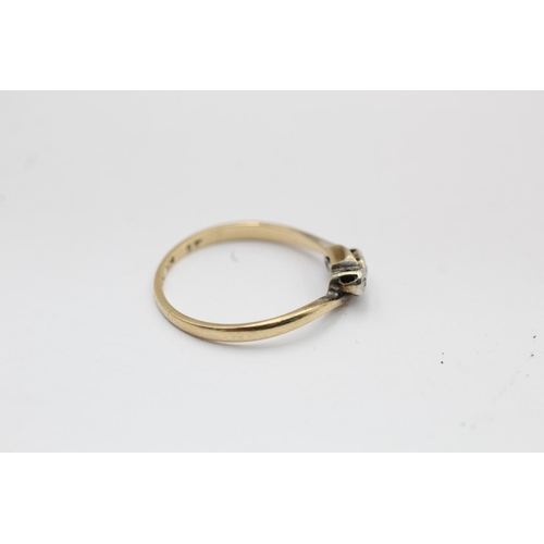 2295 - A 9ct gold and platinum diamond bypass band ring, size P½ - approx. gross weight 1.5 grams