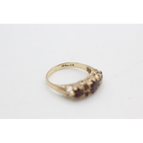 2296 - A 9ct gold garnet gypsy set ring, size N - approx. gross weight 2.1 grams