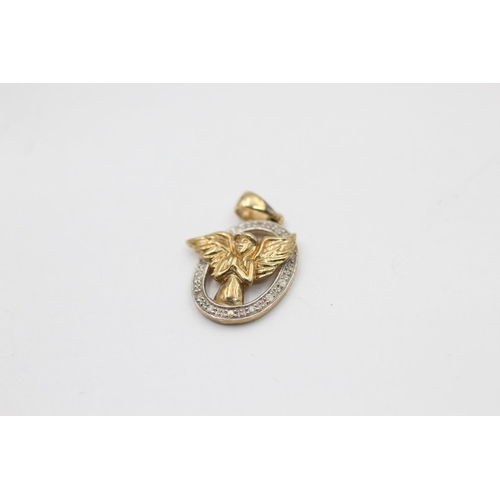 2303 - Two 9ct diamond pendants, one yellow gold winged angel and one white gold foliate design - approx. g... 