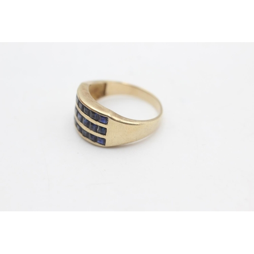 2306 - A 9ct gold three row sapphire fronted band ring, size N - approx. gross weight 3.2 grams