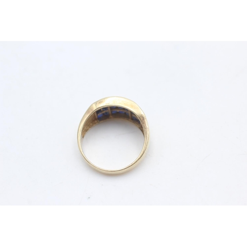 2306 - A 9ct gold three row sapphire fronted band ring, size N - approx. gross weight 3.2 grams